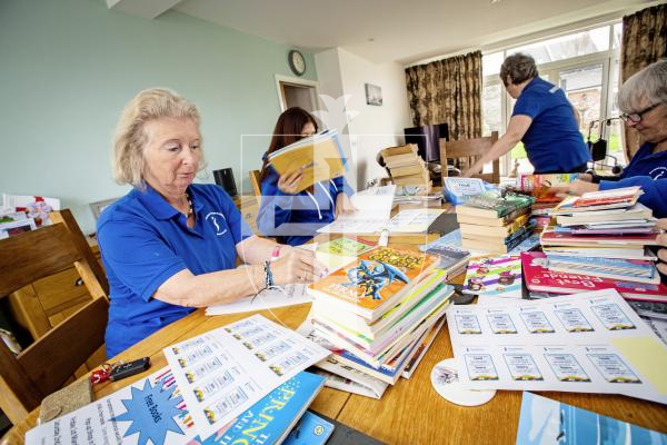 Picture by Sophie Rabey.  23-02-24.  Preview for World Book Day, Soroptimists are giving away childrens book on 1st and 2nd March from the popup shop in Smith Street.  Members of Soroptimists pictured adding stickers to the books.
Rachel Hockey.