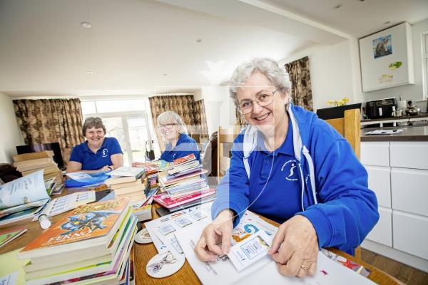 Picture by Sophie Rabey.  23-02-24.  Preview for World Book Day, Soroptimists are giving away childrens book on 1st and 2nd March from the popup shop in Smith Street.  Members of Soroptimists pictured adding stickers to the books.
L-R Shirley Marsh, Sue Taylor and Claire Teed.