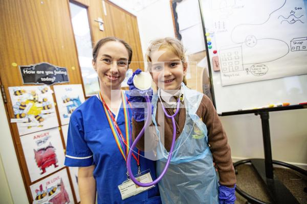 Picture by Sophie Rabey.  26-02-24.   ICU nurse, Tiffany Le Boutillier, visited reception children at St Mary & St Michael's school to talk about how she enjoys her career of being a nurse.  The children had a chance to try out some equipment.
ICU nurse, Tiffany Le Boutillier and Gabriela Emidio (aged 4).