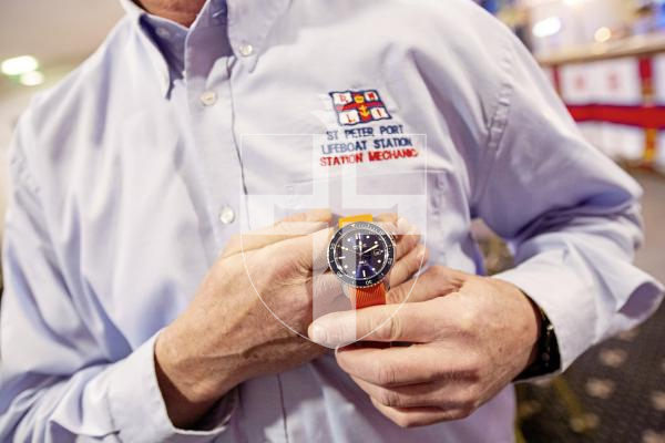 Picture by Sophie Rabey.  02-03-24.  RNLI 200th Anniversary celebrations at Peninsula Hotel.
Guernsey RNLI mechanic Carl Bisson with a watch created in partnershop with Bremont for the 200th anniversary of RNLI.