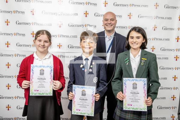 Picture by Peter Frankland.  18-06-24.  Guernsey Press Design An Ad 2024 at St Pierre Park.  
Guernsey Electricity - Sponsor, Matt Jones, Students L-R Caitlyn Casey (3rd), Oliver O’Neill (2nd), Malie Moore (1st).