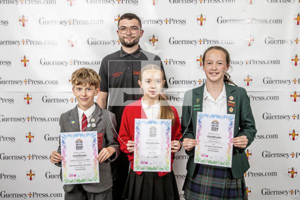 Picture by Peter Frankland.  18-06-24.  Guernsey Press Design An Ad 2024 at St Pierre Park.  
Guernsey Mobility - Sponsor, Ethan Tonks, Students L-R Freddie Fawkner-Corbett (3rd), Lyla Loughlin (2nd), Lottie Holland (1st).