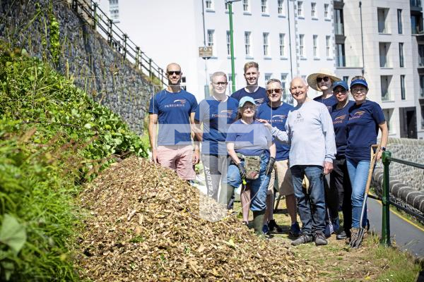 Picture By Peter Frankland. 20-06-24 Perigrine Wealth staff have been helping to clear up La Vallette and lay woodchips in the gardens to prevent weed growth.