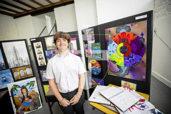 Picture by Sophie Rabey.  21-06-24.  Blanchelande College A Level and GCSE Art Show.
Gabriel Mc Connell (16) next to his GCSE artwork.