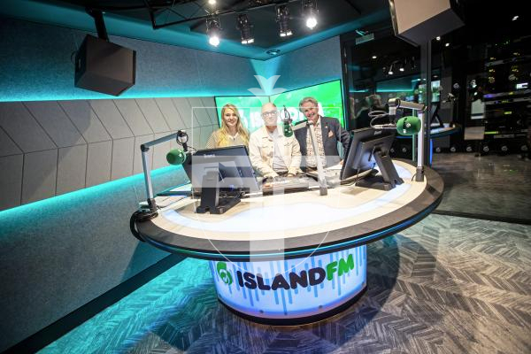 Picture by Sophie Rabey.  24-06-24.  Island FM have moved home to a space in the Bordage, official opening today.
L-R Holly Brown, David Francis and Marky T.