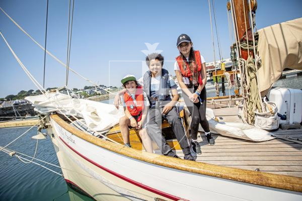 Picture by Sophie Rabey.  26-06-24.   School children have been out on the water for Set Sail Trust's Pilot Cutters Week.  
Vauvert School chilrden L-R Seth Kenyon (11), Issaac Shell (11) and Tia Etesse (11).