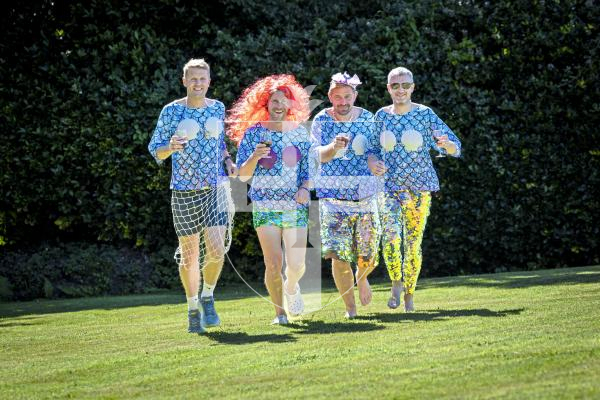 Picture by Peter Frankland. 03-07-25 Tom Falla and some of his friends are running the Medoc marathon (which involves drinking a glass of wine every mile) dressed as mermaids to raise money for MND charities. Tom's wife, Daisy, has MND. L-R - Dom Heaume, Tom Falla, Adam Dorey and James Draper.