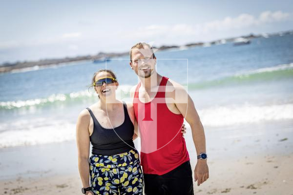 Picture by Sophie Rabey.  07-07-25.  Ellie Tanguy and Matt Holland have taken on the challenge of swimming the full 30 bays in 30 days for Les Bourgs Hospice in one day.  Met them at Grande Rocque, almost half way through the challenge.