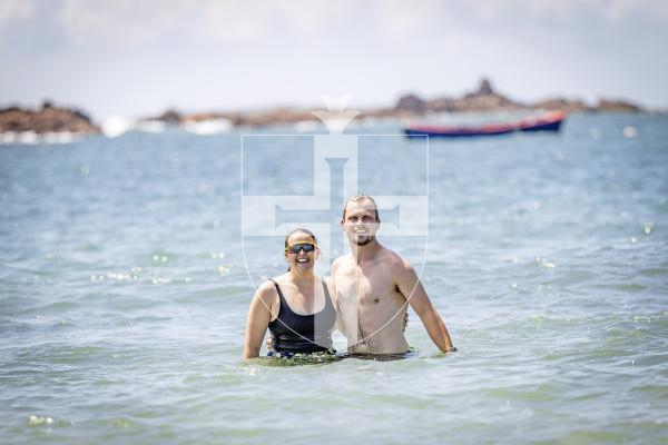 Picture by Sophie Rabey.  07-07-25.  Ellie Tanguy and Matt Holland have taken on the challenge of swimming the full 30 bays in 30 days for Les Bourgs Hospice in one day.  Met them at Grande Rocque, almost half way through the challenge.