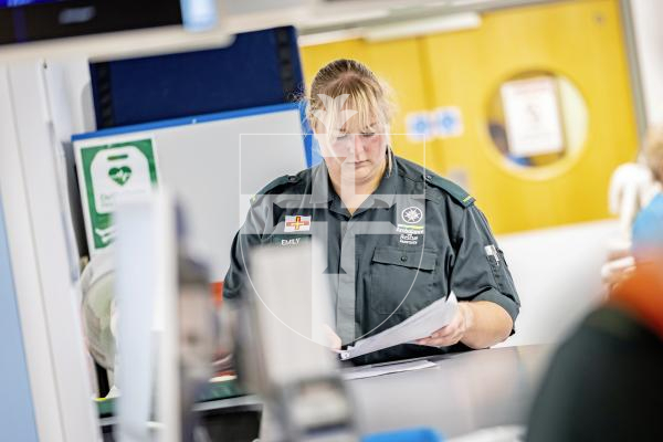 Picture by Peter Frankland. 07-07-25 The Guernsey Press have been invited on a shift with the Ambulance and Rescue Service to observe what they do. For World Paramedic Day feature. Paramedic Emily Baudains doing the paperwork at the PEH.