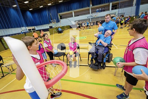 Picture by Sophie Rabey.  08-07-25.  A day of sports at Beau Sejour with students from St Martins Primary School and members of Guernsey Mobility, Lets Go!.  The children helped to assist those less able than them to compete in the challenges.
