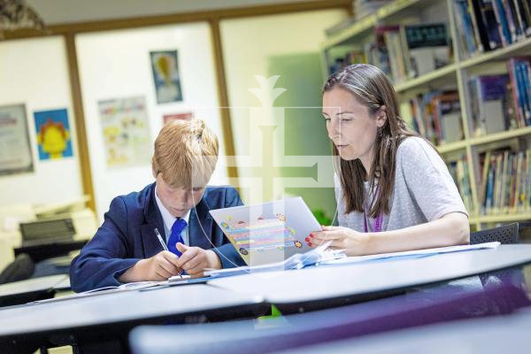 Picture by Peter Frankland. 07-07-25 The Literacy Initiative has launched formally in Guernsey and has already delivered excellent results. George James, 12 and Emily Gabb, Secondary Intervention Learning Support Assistant.