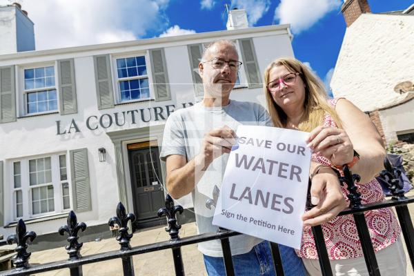 Picture by Peter Frankland. 07-07-25 A petition has been started against the proposals to cover the stream in the Water Lanes to allow cyclists to use the area. Darren and Natalie Davison of La Couture Inn have started the petition.