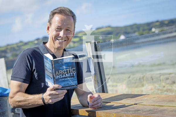 Picture by Peter Frankland. 07-07-25 Jules Mountain has flown from Canada to Guernsey in a helicopter. The trip was over 4,000 miles and took place over the polar ice cap. He has written a book about his adventure which has now been published.
