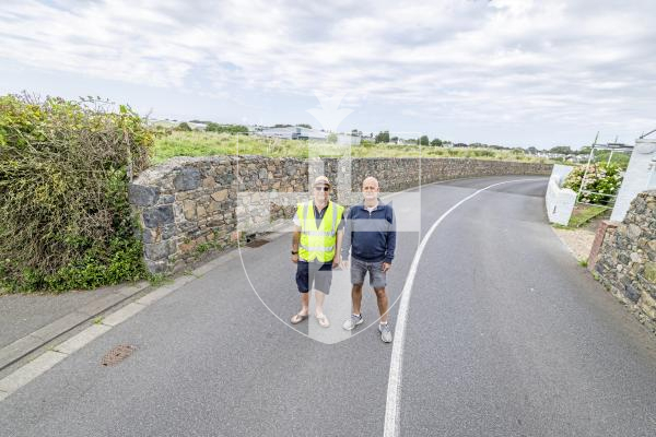 Picture by Peter Frankland. 14-07-25 L-R - Joe Abbotts and Karl Guille of St Sampson's Douzaine at the site in the Saltpans where plans are being made to put in two roads to service a new housing development.