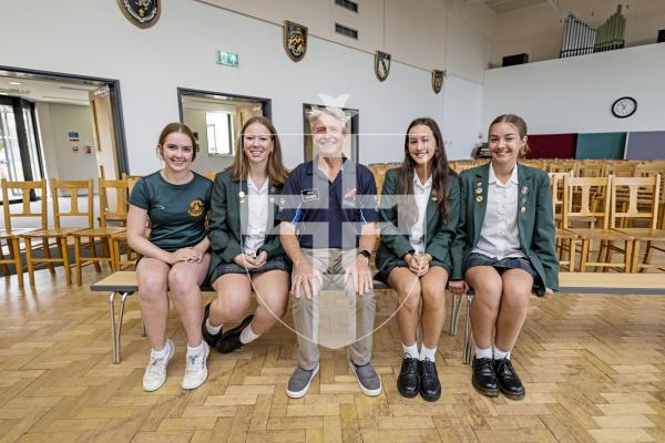 Picture by Sophie Rabey.  09-09-25.  Ahead of Guernsey Air Display tomorrow, some of the pilots visited local schools to give presentations to students.  Rich Goodwin, who flys the Jet Pitts, gave a talk to The Ladies College.
Students L-R Holly Lavin, Poppy Robison, Lottie Colmer and Lily Hurrell (all 14 years old) asked Rich Goodwin some questions about his life as a pilot.