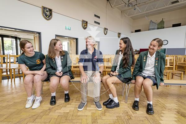 Picture by Sophie Rabey.  09-09-25.  Ahead of Guernsey Air Display tomorrow, some of the pilots visited local schools to give presentations to students.  Rich Goodwin, who flys the Jet Pitts, gave a talk to The Ladies College.
Students L-R Holly Lavin, Poppy Robison, Lottie Colmer and Lily Hurrell (all 14 years old) asked Rich Goodwin some questions about his life as a pilot.