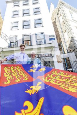 Picture by Peter Frankland. 10-09-25 Ruins of an old mill have been found during renovation work at No 1 Mill Street. L-R - Daniel Klaassen and David Savident with the 16th century standard of the King. It links No1 Mill Street with the Kings Mills in St Peter Port.