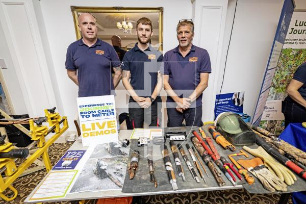 Picture by Sophie Rabey.  20-09-25.   Guernsey Electricity's second Powering Life for Less event at St Pierre Park.  
L-R Gregg Nolan, Rhys Melass and Chas Bishop with the display of cables.