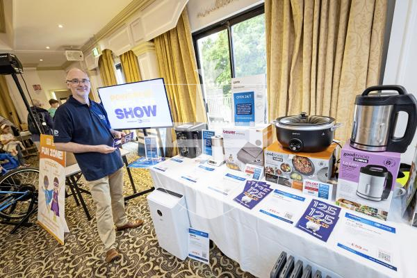 Picture by Sophie Rabey.  20-09-25.   Guernsey Electricity's second Powering Life for Less event at St Pierre Park.  
Malcolm Woodhams, Head of Retail, with some examples of more energy efficient household appliances.