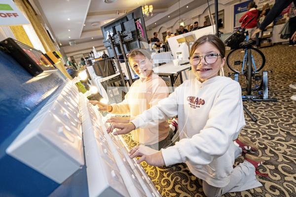 Picture by Sophie Rabey.  20-09-25.   Guernsey Electricity's second Powering Life for Less event at St Pierre Park.  
Twins L-R Emilia and Mya Leale (12) seeing how quickly they can turn all light switches off.
