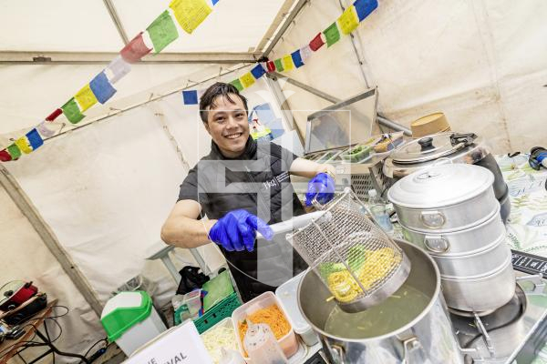 Picture by Sophie Rabey.  02-10-25.  'A Table in Guernsey' food festival at Market Square.  
Head Chef from the Himalayan Kitchen, Bikash Tamang, serving up a Himalayan Sherpa Noodle Soup.