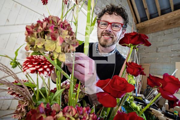 Picture by Peter Frankland. 08-10-25 Florist John Paul Deehan is over at the invite of Floral Design Guernsey. Here he is pictured putting together some designs using some locally sourced materials.