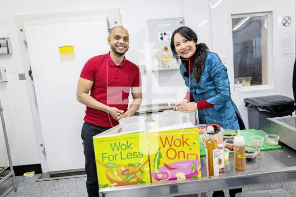 Picture by Sophie Rabey. 18-10-25.  Taiwanese-born British Celebrity chef, Ching-He Huang, visited Guernsey and gave a cooking demonstration in Guernsey Prison, organized by Guernsey Community Savings.
Prisoner Mohammed Ahmed, with Ching-He Huang.