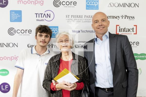 Picture by Sophie Rabey.  18-10-25.  Pride of Guernsey Awards 2025 at St Pierre Park.  Winner of Grandparent of the Year – Mary Bennalick (and grandson Zack Lanyon) with sponsor Richard Quinn - Channel Islands Co-operative Society.