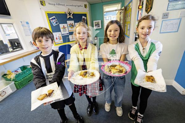 Picture by Sophie Rabey.  20-11-25.  To celebrate World Childrens Day, St Martins Primary School had a full day of activities based around this years theme of 'multiculture'.
Different cultural foods including Guernsey Gache Melee, New Zealand Maori Hangi and Lebanese delights.
L-R Toby Mullin (9), Mollie Boatwright-Smith (9), Juno Bamford (8) and Ava Marley (8).