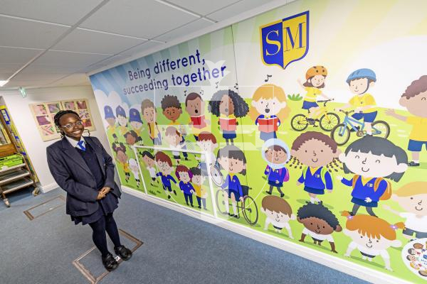 Picture by Sophie Rabey.  20-11-25.  To celebrate World Childrens Day, St Martins Primary School had a full day of activities based around this years theme of 'multiculture'.
Aviella Kabunga (11) was a student who left St Martins School last year and had the idea of creating a wall to visually show diversity within the school.  She came back today to officially open the wall to the school.  It was funded through the schools PTFA.