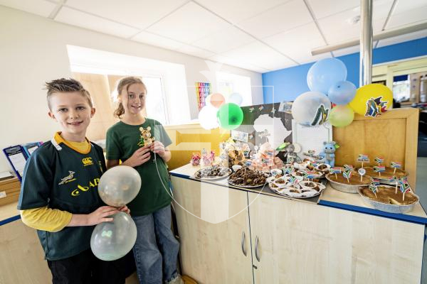 Picture by Sophie Rabey.  20-11-25.  To celebrate World Childrens Day, St Martins Primary School had a full day of activities based around this years theme of 'multiculture'.
L-R James Goosen (8) and Maria Roos (10) were part of helping with this years theme and celebration of World Childrens Day.  They are pictured with a platter of South African Treats.