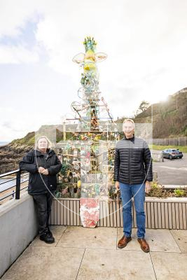 Picture by Sophie Rabey.  25-11-25.  Vive La Vallette and The Clean Earth Trust have collaborated on a project to transform waste from Guernsey's coastline/landfill into something beautiful - a Christmas Tree!  
Paul Bugdon and Julie Embling are pictured next to the festive creation at the Bathing Pools.