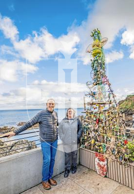 Picture by Sophie Rabey.  25-11-25.  Vive La Vallette and The Clean Earth Trust have collaborated on a project to transform waste from Guernsey's coastline/landfill into something beautiful - a Christmas Tree!  
Paul Bugdon and Julie Embling are pictured next to the festive creation at the Bathing Pools.