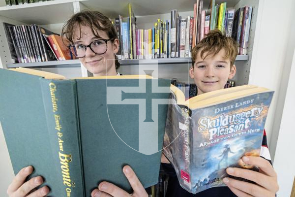 Picture by Peter Frankland. 25-11-25 Read-a-thon at Elizabeth College where students are encouraged to challenge themselves to read books while raising money for charity. L-R - Emily Garland, 13 and Henry Wilson, 11.