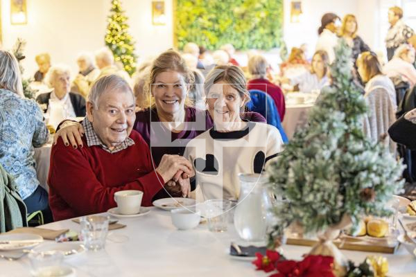 Picture by Sophie Rabey.  02-12-25.   Dementia Friendly, Boogie in the Bar" at The Penninsula Hotel.  This christmas social event is organized by Dementia Friendly Guernsey for people with dementia, their families, and carers, featuring familiar music, gentle dancing, refreshments, and conversation.
L-R David Tostevin, Corina Woodland (Director at Saumarez Park Manor) and Donna Haines.