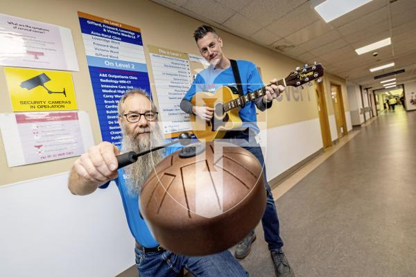 Picture by Sophie Rabey.  03-12-25.  Marcel Lenormand and Mark O'Neil are two School of Popular Music trained 'healthcare musicians' that work in the hospital.  They visit wards and interact and play music to anyone who might want to engage with it while in hospital.