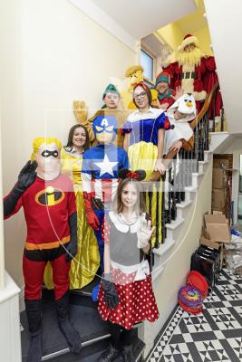 Picture by Sophie Rabey.  05-12-25.  The Bridge Christmas Light switch on was cancelled due to the bad weather but Father Christmas still made it to Ray & Scott, accompanied by a number of other characters from St Sampsons High School.
Going up stairs bottom to top : Grace Ruskin (Year 7), Nolan Buddery (Year 8), Gracie Stewart (Year 11), Daniel James (Year 8), Sofia Gois (Year 11), Charlie Blaize (Year 7), Nathan Mullins (Year 10), Toby Diment (Year 10), Mr Lee PD (Santas Elf) and Father Christmas.