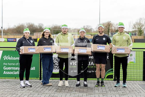 Picture by Sophie Rabey.  08-12-25.  Wrapping of the Victoria Park Food & Kit Bank hampers at Victoria Park.  Representatives from GFC, GFA, Victoria Park and Aztech were there to help out.
L-R Aimee Ogier, Hayley Vance, Charlton Gauvain, Brandon Wallace, Ross Allen and Jacques Cauvin.