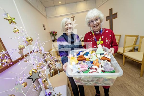 Picture by Sophie Rabey.  08-12-25.  A team of enthusiastic knitters at St Andrew’s parish church have prepared more than 200 colourful knitted angels to bring Christmas joy to staff and patients at the Princess Elizabeth Hospital.  Judy Barker handed them over today to Revd Linda Le Vasseur.