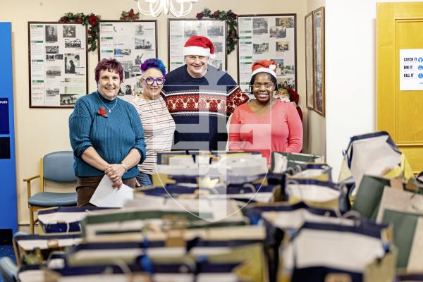 Picture by Sophie Rabey.  18-12-25.  Donation of gift packages from The Lions Club of Guernsey's annual 'Project Sparkle' initiative.  They dropped off bags to the Jubilee Day Centre that will be delivered out alongside the meals on wheels service.
L-R Sharon Williams (Meals On Wheels Coordinator), Mandy Le Bachelet (GVS Manager), Rob Holder (Lions Club) and Tia Sibanda (Project Sparkle lead)