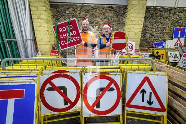 Picture by Peter Frankland. 22-12-25 At Christmas most of the States' road signs get a well deserved week off. L-R - Andy Brown, Signs and Lines Supervisor and Milton Le Moignan, Service Manager.