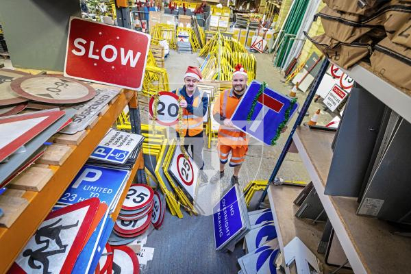 Picture by Peter Frankland. 22-12-25 At Christmas most of the States' road signs get a well deserved week off. L-R - Milton Le Moignan, Service Manager and Andy Brown, Signs and Lines Supervisor.