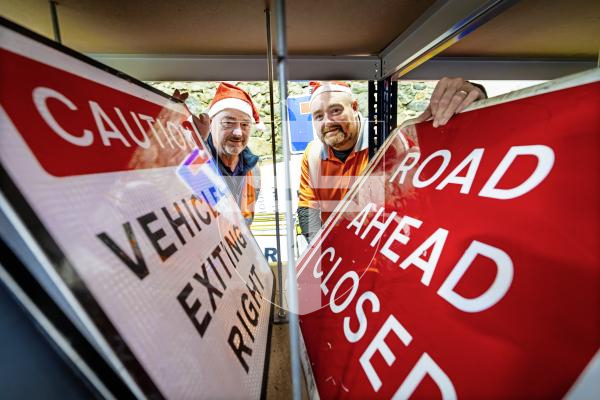 Picture by Peter Frankland. 22-12-25 At Christmas most of the States' road signs get a well deserved week off. L-R - Milton Le Moignan, Service Manager and Andy Brown, Signs and Lines Supervisor.