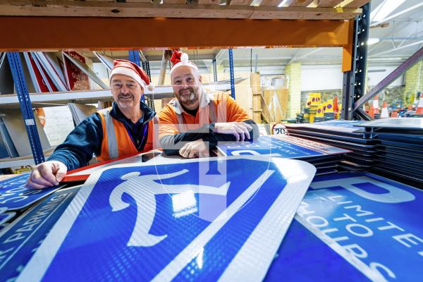 Picture by Peter Frankland. 22-12-25 At Christmas most of the States' road signs get a well deserved week off. L-R - Milton Le Moignan, Service Manager and Andy Brown, Signs and Lines Supervisor.
