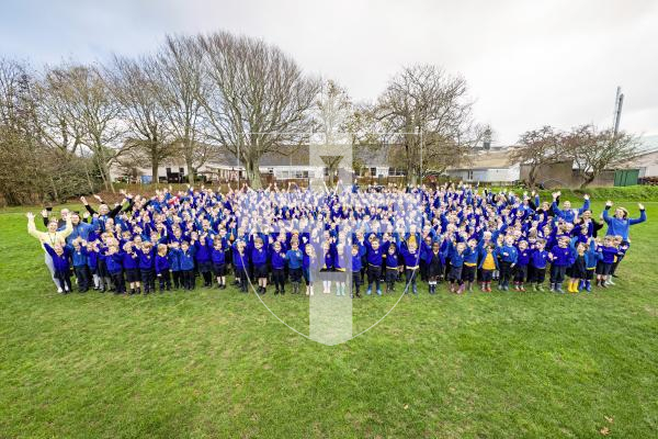 Picture by Sophie Rabey.  Picture Review of the Year 2025.  November.
This was up there with one of the most wholesome jobs I’ve done this year.  We had arranged with St Martins Primary School to perhaps set up a picture to run on front page for World Children’s Day.  The headteacher Clare Giles was fantastic and offered me the whole school for a photo on the playing field, unfortunately just as we all assembled the heavens opened with hail.  The children screamed and we got the ideal picture!