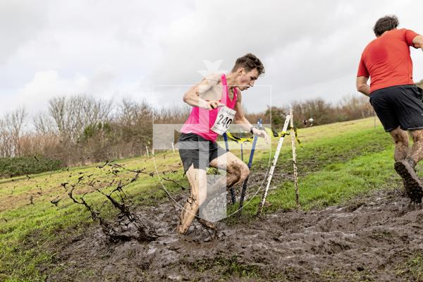 Picture by Sophie Rabey.  Picture Review of the Year 2025.  December.
It was a very cold and muddy day up at St Germain watching the Guernsey Athletics Club Cross-Country Championships.  I was slipping about in my trainers and I wasn’t trying to get around the field at speed, it was quite impressive watching the runners doing a brilliant job at staying on their feet.  First finisher, Jack Rees was flying the whole way and I was very happy to capture this low, wide angle shot of him as he hit a deep muddy corner.