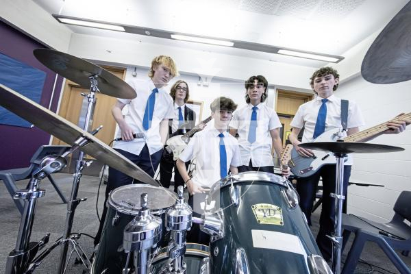 Picture by Peter Frankland. 14-01-26 Les Beaucamp school band Out of Sync are preparing to take to the stage at the Thirst Music Battle of the Bands. L-R - Bobby Broughton, 14, Sami Bamford, 14, Max Roger, 15, Marco Palmeri, 15 and Josh Pailing, 15.