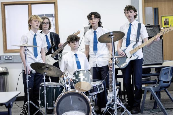 Picture by Peter Frankland. 14-01-26 Les Beaucamp school band Out of Sync are preparing to take to the stage at the Thirst Music Battle of the Bands. L-R - Bobby Broughton, 14, Sami Bamford, 14, Max Roger, 15, Marco Palmeri, 15 and Josh Pailing, 15.
