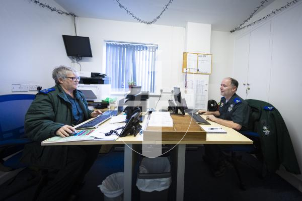 Picture by Peter Frankland. 23-02-26 Ride out with Patient Transfer Service, part of the Ambulance and Rescue Service. Nicky Strong and Dave Edwards in their small office at the station.